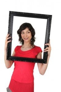 Woman holding a picture frame